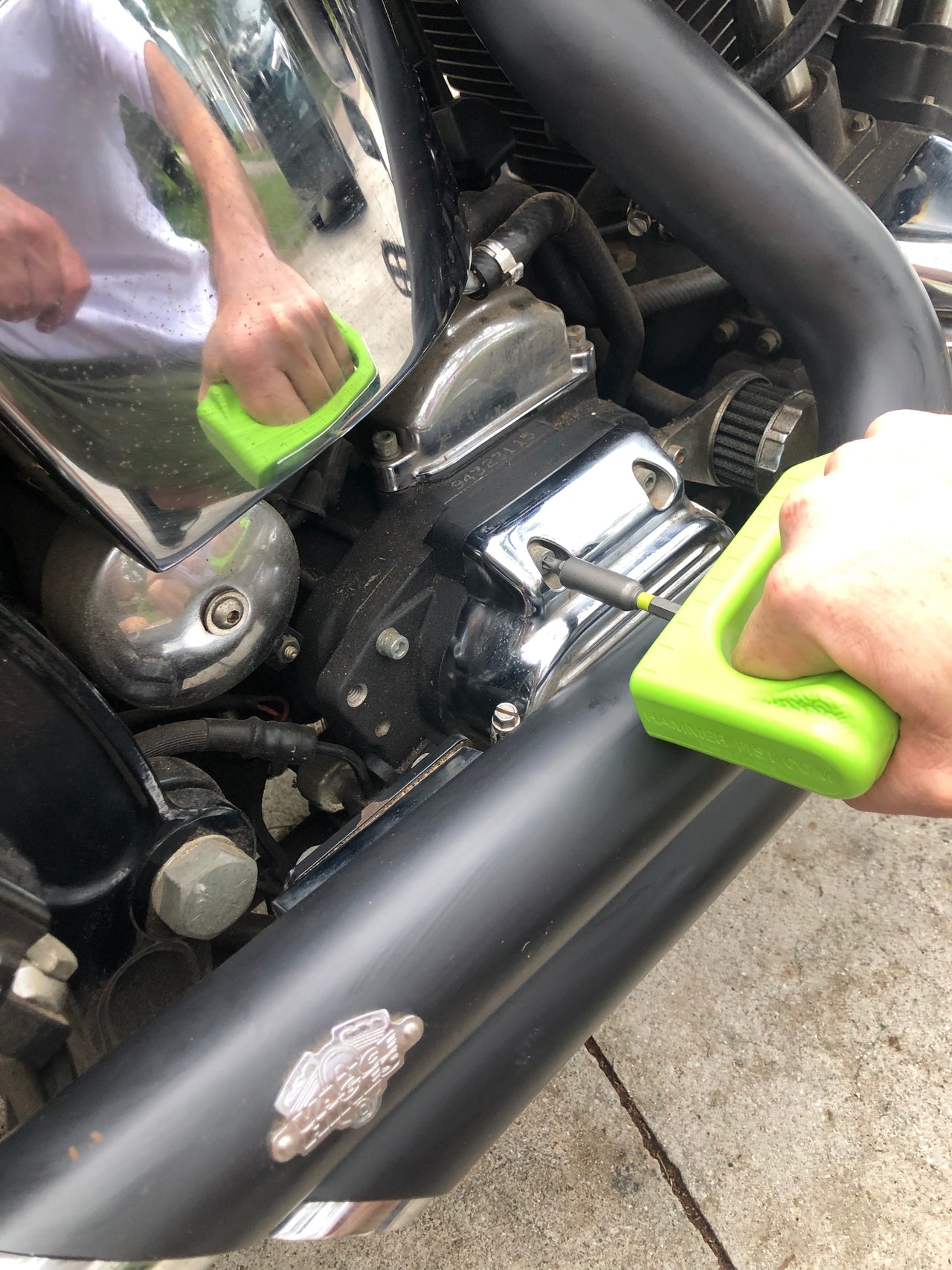 hammer fist hex key feature being used to fix motorcycle