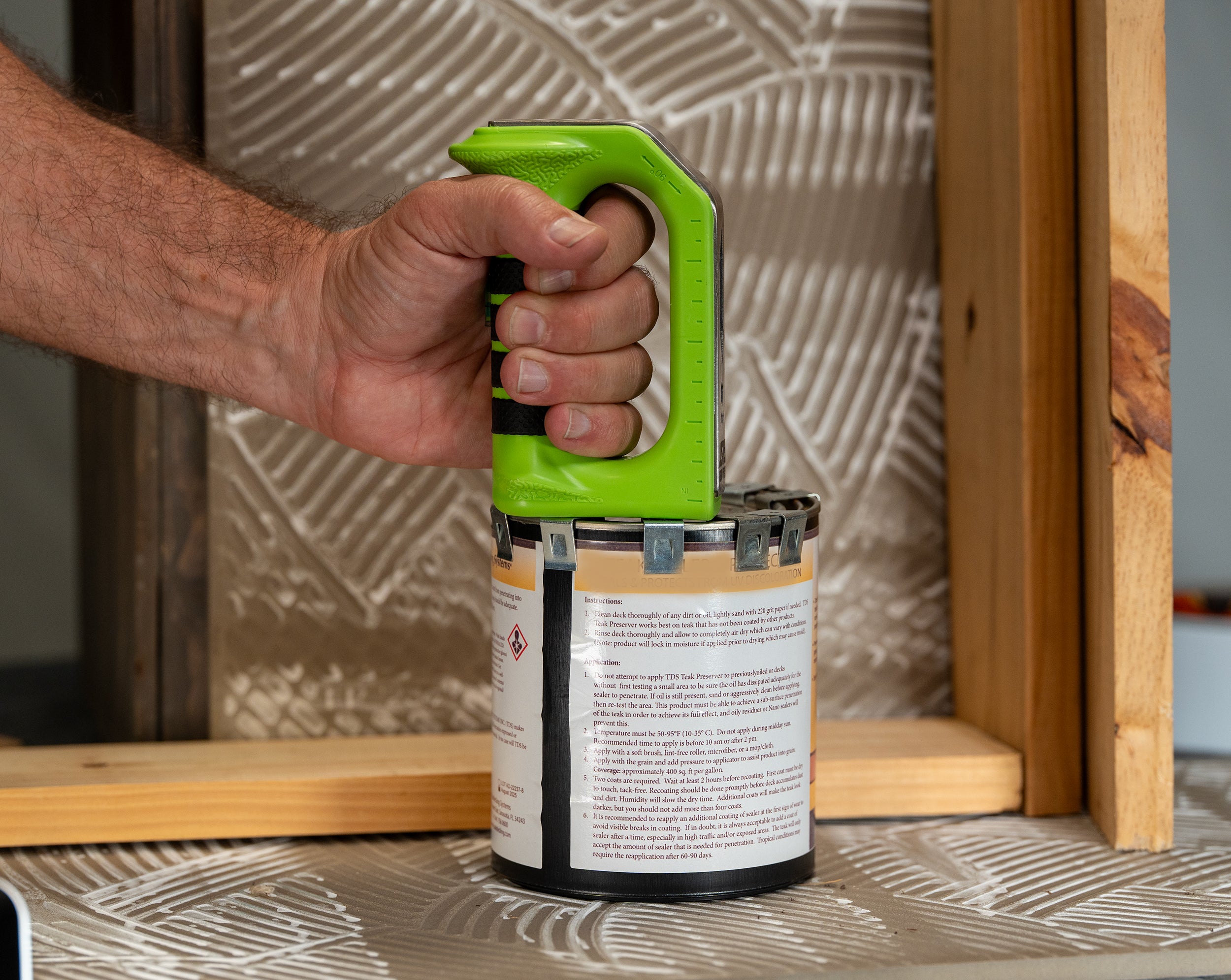 Hammer Fist tool opening a paint can
